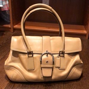 Tan hobo-style COACH handbag